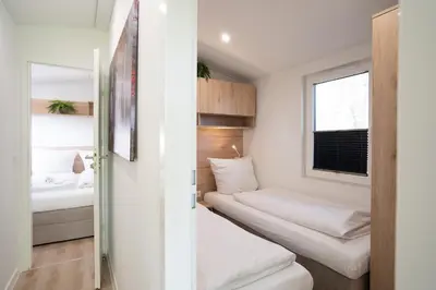 Ein Bett oder Betten in einem Zimmer der Unterkunft Ostseecamp Ferienhaus 