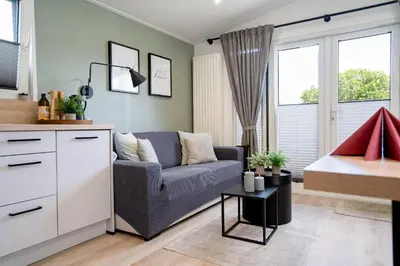 Ein Bett oder Betten in einem Zimmer der Unterkunft Ostseecamp Ferienhaus 