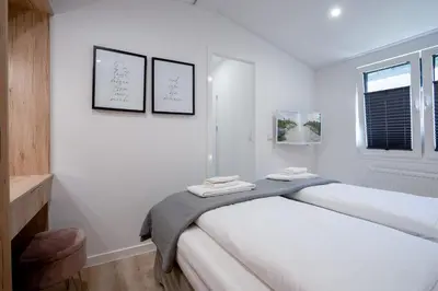 Ein Bett oder Betten in einem Zimmer der Unterkunft Ostseecamp Ferienhaus 