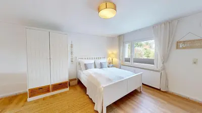 Ein Bett oder Betten in einem Zimmer der Unterkunft Amselweg - Sandkorn