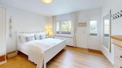 Ein Bett oder Betten in einem Zimmer der Unterkunft Amselweg - Sandkorn