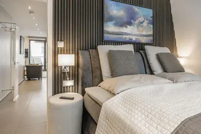 Ein Bett oder Betten in einem Zimmer der Unterkunft Beach House Penthousewohnung Leuchtturm