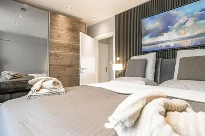 Ein Bett oder Betten in einem Zimmer der Unterkunft Beach House Penthousewohnung Leuchtturm