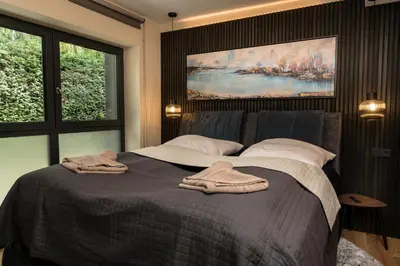 Ein Bett oder Betten in einem Zimmer der Unterkunft Wellness House Energy mit Whirlpool