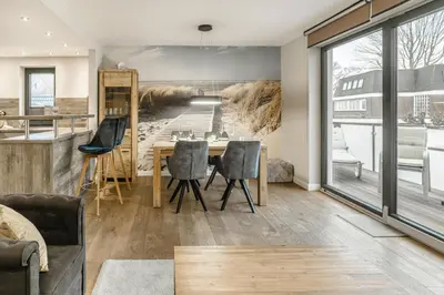 Ein Sitzbereich in der Unterkunft Beach House Strandkorb