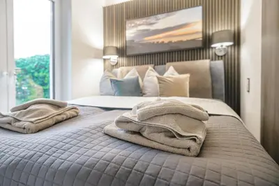 Ein Bett oder Betten in einem Zimmer der Unterkunft Baltic House Welle
