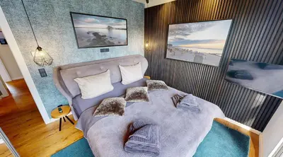 Ein Bett oder Betten in einem Zimmer der Unterkunft Heaven House Family