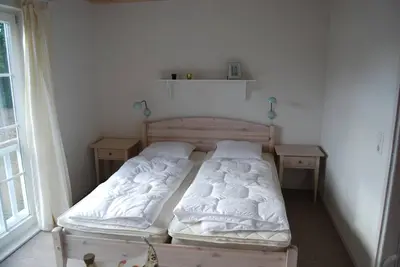 Ein Bett oder Betten in einem Zimmer der Unterkunft Ferienhaus Meerblick