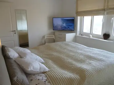 Ein Bett oder Betten in einem Zimmer der Unterkunft Ostsee-Wellnesslandhaus mit Sauna, Jacuzzi, Innenwhirlpool