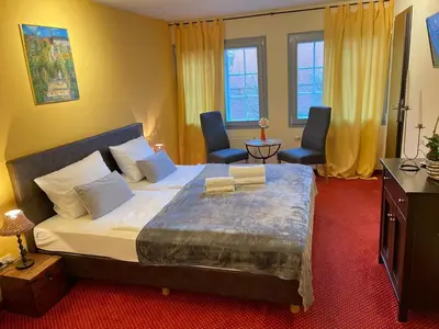 Ein Bett oder Betten in einem Zimmer der Unterkunft Hotel Restaurant Iris
