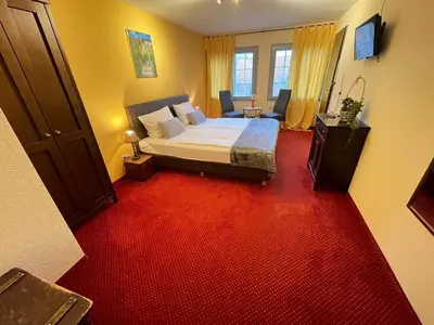 Ein Bett oder Betten in einem Zimmer der Unterkunft Hotel Restaurant Iris