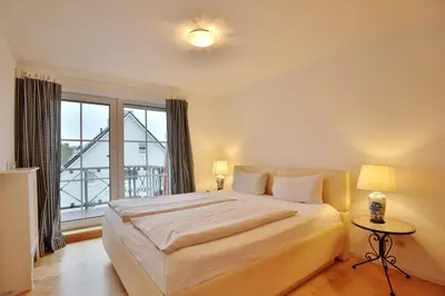 Ein Bett oder Betten in einem Zimmer der Unterkunft Kurparkresidenz Timmendorfer Strand Appartement 31