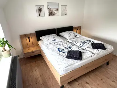 Ein Bett oder Betten in einem Zimmer der Unterkunft Große Ferienwohnung in Ostseenähe