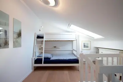 Ein Bett oder Betten in einem Zimmer der Unterkunft STA200 Ferienwohnung Dünengras