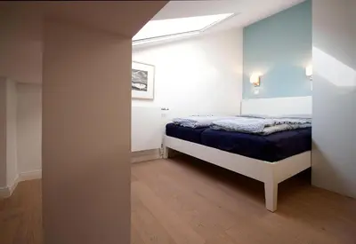 Ein Bett oder Betten in einem Zimmer der Unterkunft STA200 Ferienwohnung Dünengras