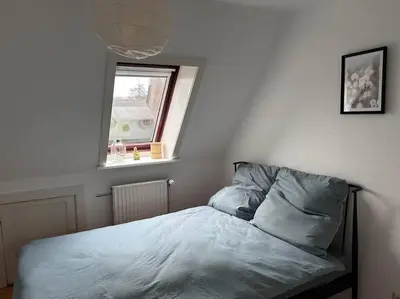 Ein Bett oder Betten in einem Zimmer der Unterkunft Ferienhaus am Poggensee