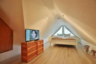 Ein Bett oder Betten in einem Zimmer der Unterkunft Ferienappartement Strandallee 150a Appartement 3