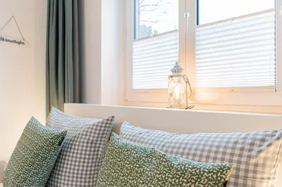 Ein Bett oder Betten in einem Zimmer der Unterkunft Ferienwohnung Urlaubsflair