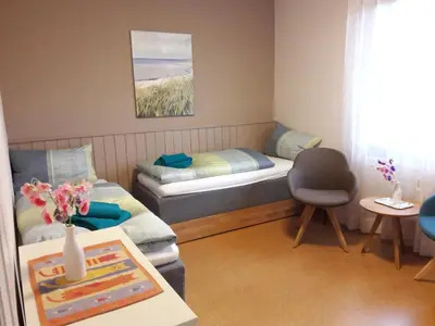 Ein Bett oder Betten in einem Zimmer der Unterkunft Appartement Siri - Strand- und Bahnhofsnah