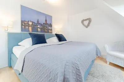 Ein Bett oder Betten in einem Zimmer der Unterkunft Fischerhus
