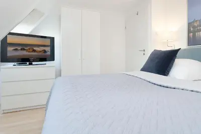 Ein Bett oder Betten in einem Zimmer der Unterkunft Fischerhus