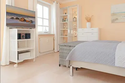 Ein Bett oder Betten in einem Zimmer der Unterkunft Ferienwohnung Meerblick und Golf