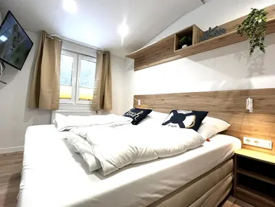 Ein Bett oder Betten in einem Zimmer der Unterkunft Ostseecamp Ostseewind
