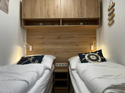 Ein Bett oder Betten in einem Zimmer der Unterkunft Ostseecamp Ostseewind