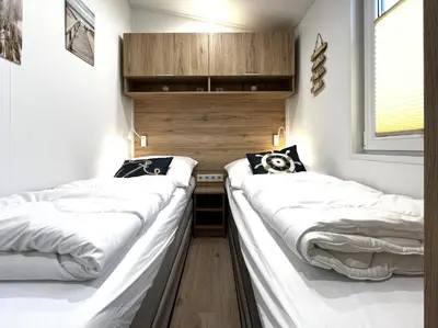 Ein Bett oder Betten in einem Zimmer der Unterkunft Ostseecamp Ostseewind