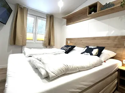 Ein Bett oder Betten in einem Zimmer der Unterkunft Ostseecamp Ostseewind