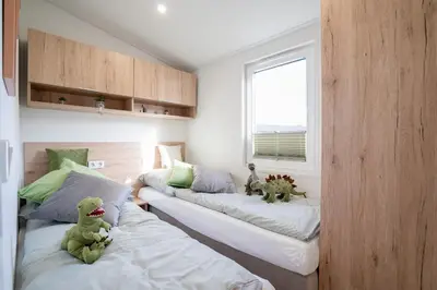 Ein Bett oder Betten in einem Zimmer der Unterkunft Ostseecamp Seehund