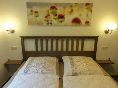 Ein Bett oder Betten in einem Zimmer der Unterkunft Adams Schwedenhaus