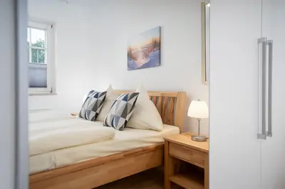 Ein Bett oder Betten in einem Zimmer der Unterkunft LIN 001 - Seepark