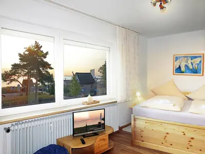 Ein Bett oder Betten in einem Zimmer der Unterkunft STR 101 - Strandallee 124 - Seeblick