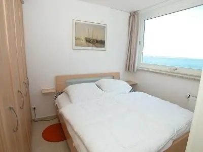 Ein Bett oder Betten in einem Zimmer der Unterkunft H5 57 - Hanseat - Seeblick