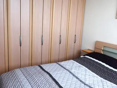 Ein Bett oder Betten in einem Zimmer der Unterkunft H5 57 - Hanseat - Seeblick