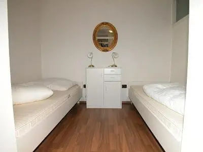 Ein Bett oder Betten in einem Zimmer der Unterkunft TER 210 - Terrassenhuegel - Teilseeblick