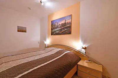 Ein Bett oder Betten in einem Zimmer der Unterkunft RES 314 - Residenz - Teilseeblick