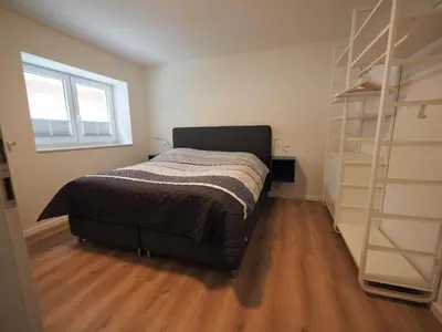 Ein Bett oder Betten in einem Zimmer der Unterkunft FIS 002 - Strandperle