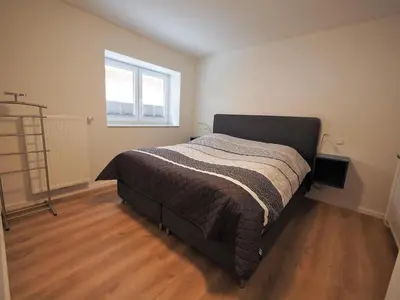 Ein Bett oder Betten in einem Zimmer der Unterkunft FIS 002 - Strandperle