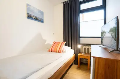 Ein Bett oder Betten in einem Zimmer der Unterkunft HOF 210 - Berliner Hof - Seeblick