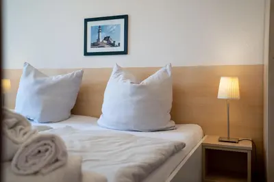 Ein Bett oder Betten in einem Zimmer der Unterkunft RES 303 - Residenz -Seeblick