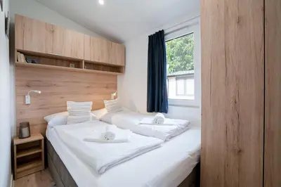 Ein Bett oder Betten in einem Zimmer der Unterkunft Ostseecamp Ferienhaus 