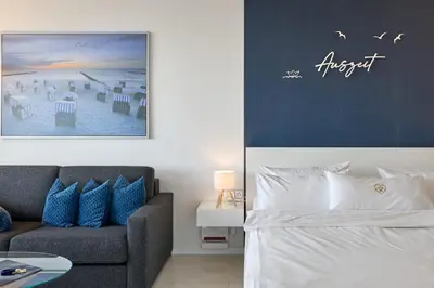 Ein Bett oder Betten in einem Zimmer der Unterkunft Plaza Premium Timmendorfer Strand Schöne Aussicht 269