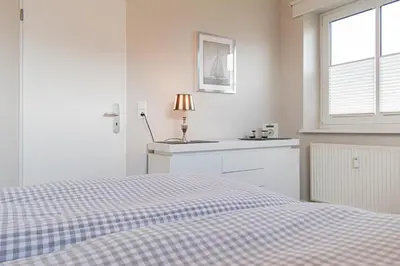 Ein Bett oder Betten in einem Zimmer der Unterkunft Ferienwohnung Lille Sand 1