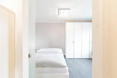 Ein Bett oder Betten in einem Zimmer der Unterkunft Ferienwohnung Lille Sand 2