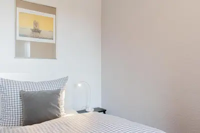 Ein Bett oder Betten in einem Zimmer der Unterkunft Ferienwohnung Lille Sand 2