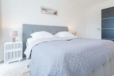 Ein Bett oder Betten in einem Zimmer der Unterkunft Strandstern