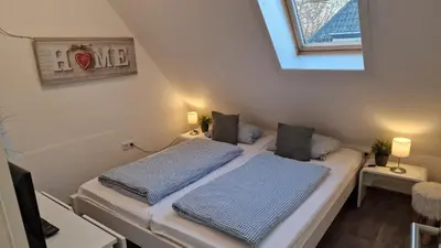Ein Bett oder Betten in einem Zimmer der Unterkunft Ferienwohnung Ostseezauber 1