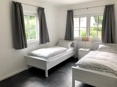 Ein Bett oder Betten in einem Zimmer der Unterkunft Ferienwohnung auf einem Reiterhof